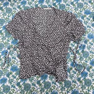 Reformation wrap top with ditsy daisy pattern